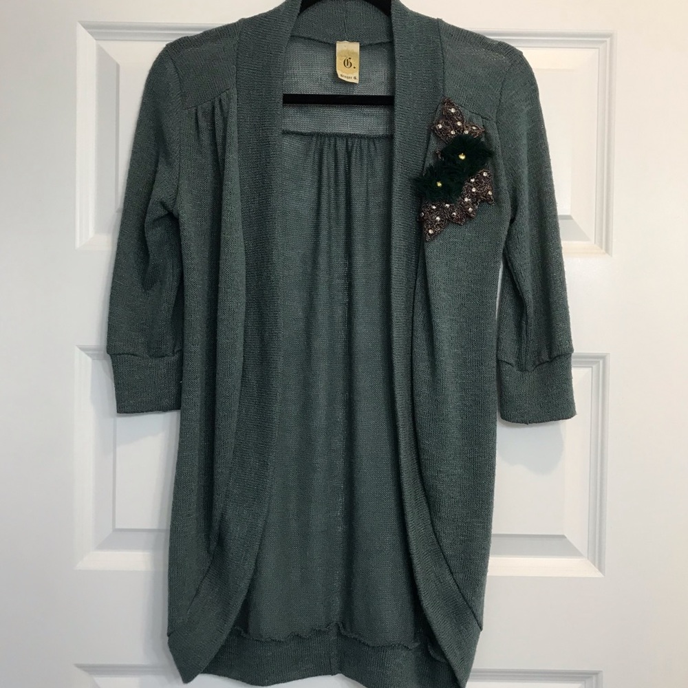 Green cardigan with darling embellishment